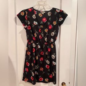 Dress by Tucker. Black with floral pattern.